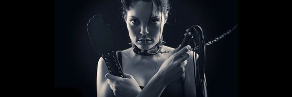 submissive woman kissing hand of her master